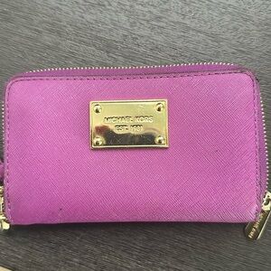 Micheal Kors purple leather wristlet